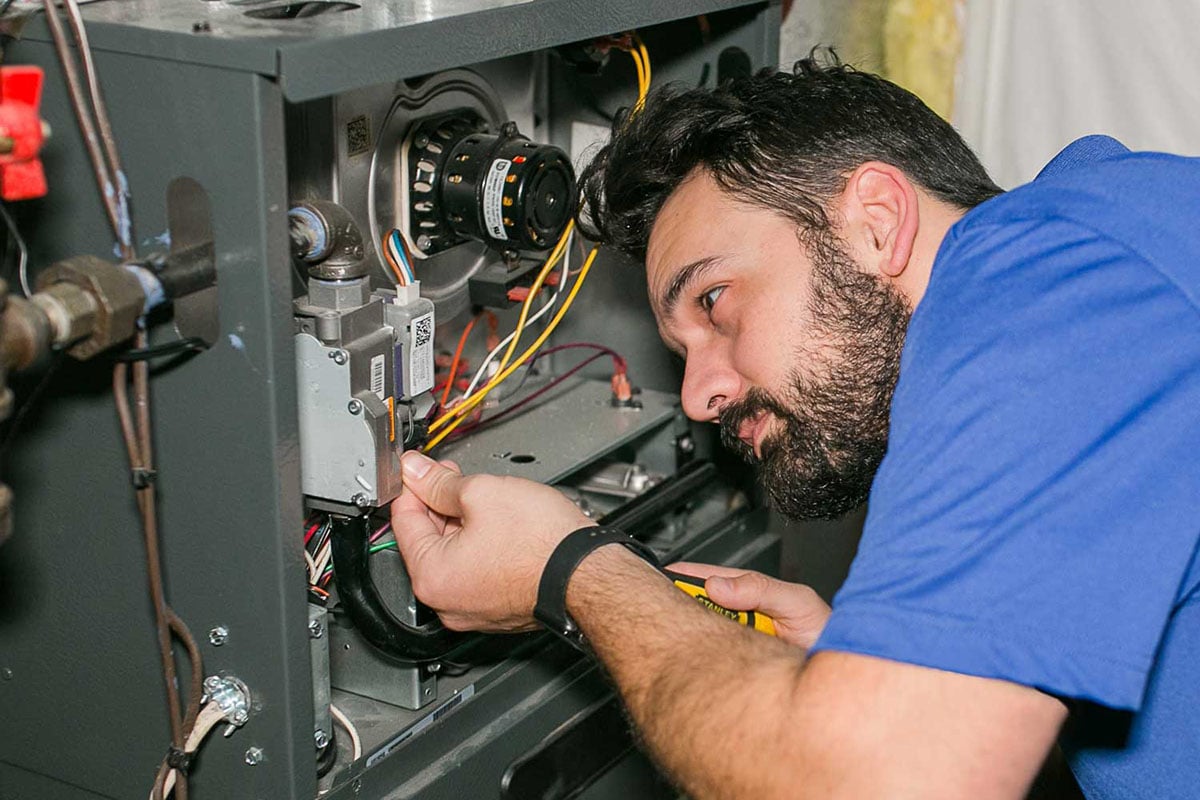 Technician working on a furnace